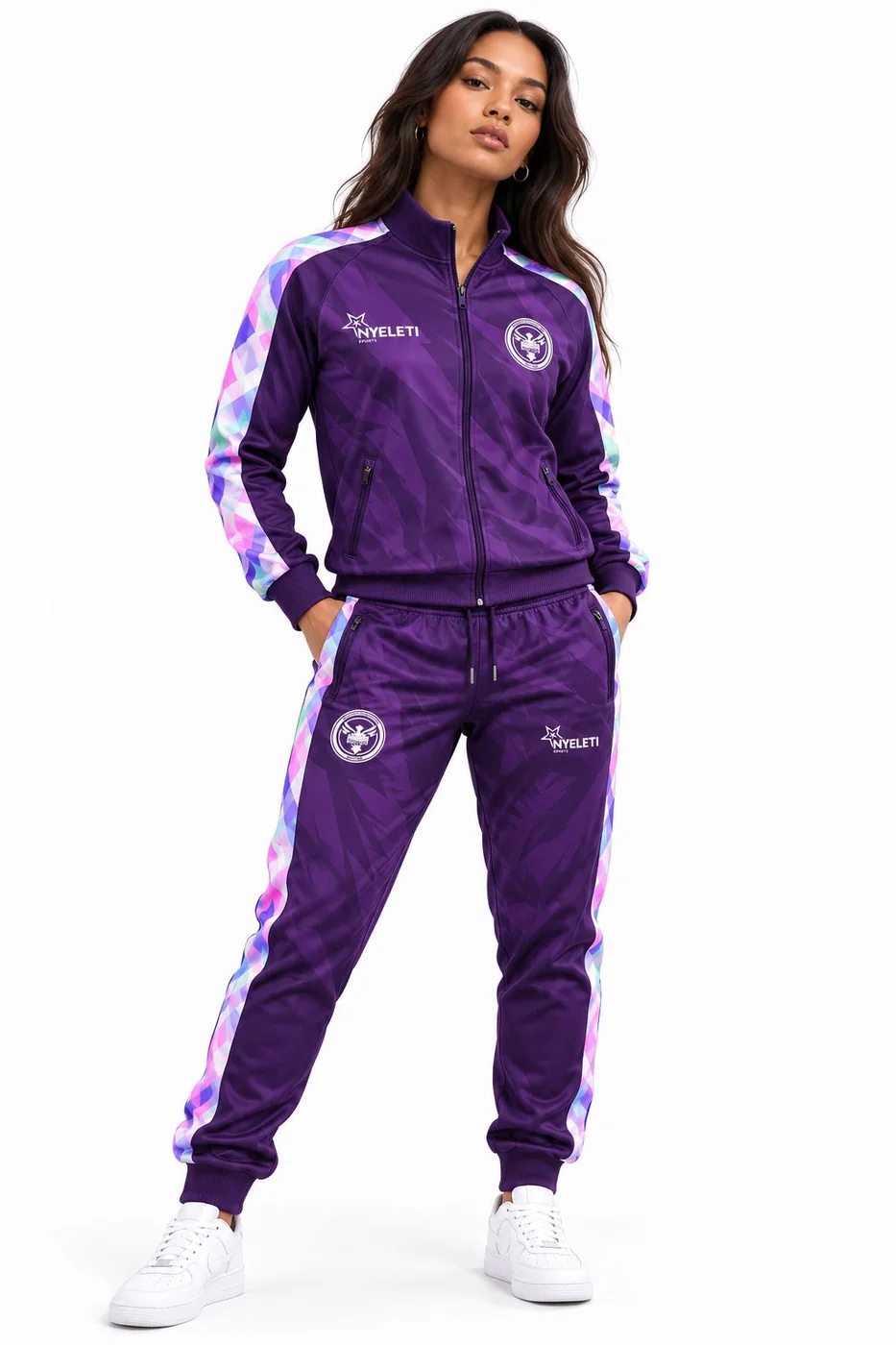 The Tembisa Funk tracksuit set in purple, worn with white sneakers